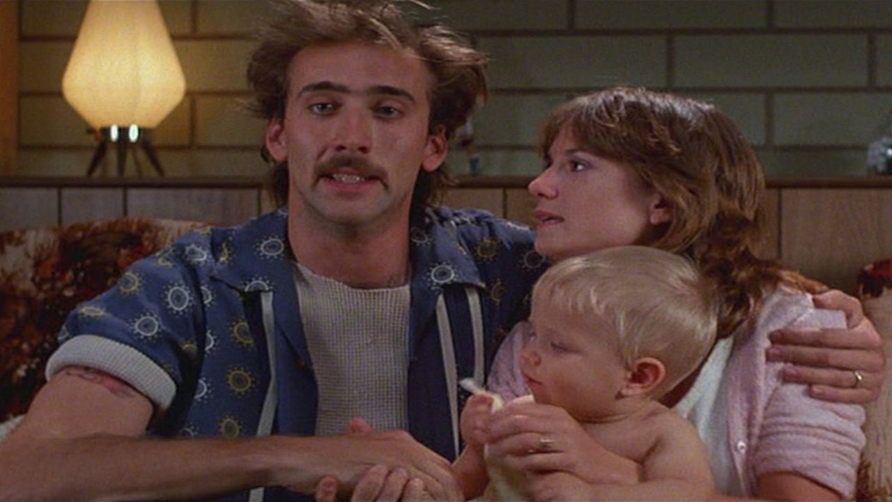 Raising Arizona (1987) - Nicolas Cage, Holly Hunter, and T.J. Kuhn